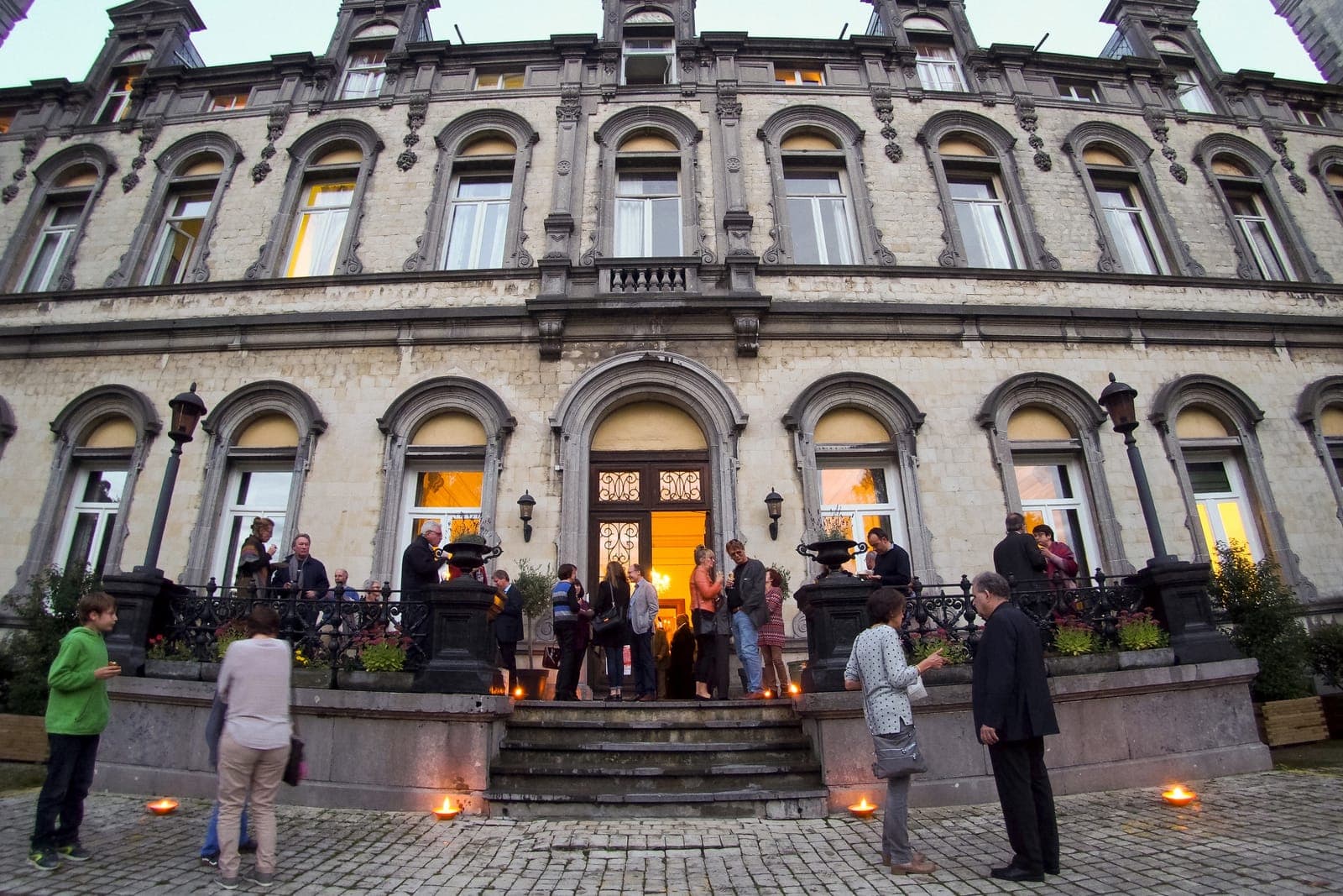 Guests arriving at the festival venue at dusk